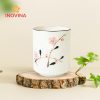 Ly sứ không quai vẽ đào quà tặng doanh nghiệp
